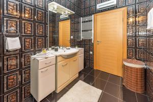 a bathroom with a sink and a toilet at S&P City Center Apartments in Kotor +92 photos