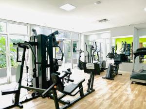 a gym with several treadmills and machines in a room at Hotel São Paulo - Avenida Paulista in Sao Paulo