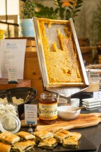 a display of honey and other food items on a table at Rigas Boutique Hotel & Spa in Afitos