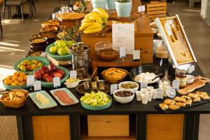a table filled with lots of different types of food at Rigas Boutique Hotel & Spa in Afitos