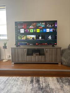 a television on a stand in a living room at Saltayr in Ayr
