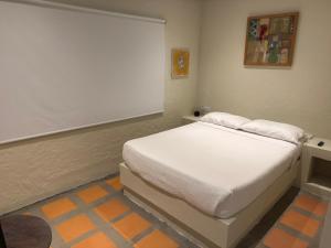 Postel nebo postele na pokoji v ubytování Jaragual EcoHostel