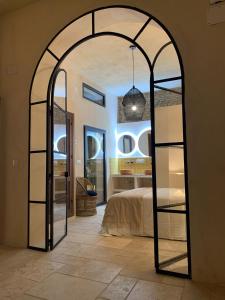 a bedroom with a large mirror in a room at Zarí Apartamentos in Córdoba