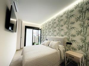 TV a/nebo společenská místnost v ubytování Flower Deluxe Bajo 2 Dormitorios 6085