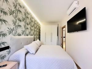 Postel nebo postele na pokoji v ubytování Flower Deluxe Bajo 2 Dormitorios 6085