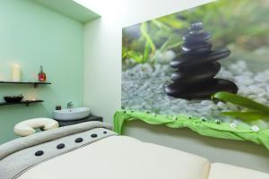 Televiisor ja/või meelelahutuskeskus majutusasutuses ALEA Hotel & Suites
