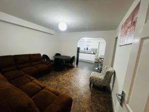 a living room with a couch and a table at Liberty Guest House in Liverpool