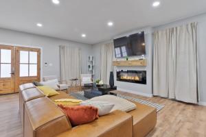 a living room with a couch and a fireplace at Private Room 2Bds Near Downtown in Indianapolis