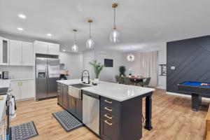 a large kitchen with a large island in the middle at Private Room 2Bds Near Downtown in Indianapolis +45 photos