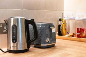 a toaster sitting on top of a kitchen counter at Grand Central , 2 double bedroom apartment with free parking , Birmingham in Birmingham