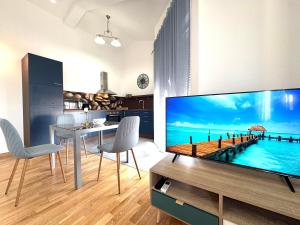 a living room with a large flat screen tv at Apartments Terra Solaris in Medulin