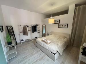 a bedroom with a bed in a room at Monky house in Casale Monferrato +6 photos