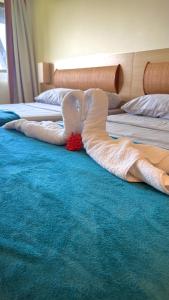 a pair of white mermaid sheets on a bed at Beach class muro alto in Porto De Galinhas +20 photos