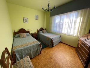 Ένα ή περισσότερα κρεβάτια σε δωμάτιο στο Casa en playa Rio Sieira
