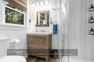 a bathroom with a sink and a shower at Mills Lakeside in Orlando