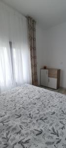 Ένα ή περισσότερα κρεβάτια σε δωμάτιο στο Seosko turističko domaćinstvo Stanković +13 φωτογραφίες