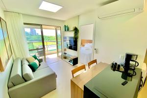 a living room with a couch and a table at Capitães de Areia in Salvador
