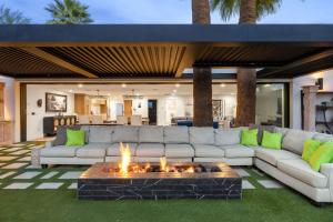 a living room with a couch and a fire pit at Arcadia Beach Club - 4-Villa Luxe Retreat with Pool in Phoenix +61 photos
