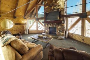 a living room with a couch and a fireplace at Cozy Rustic Escape in Park City