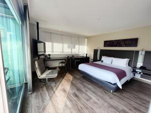 Voodi või voodid majutusasutuse Hotel bh El Poblado toas
