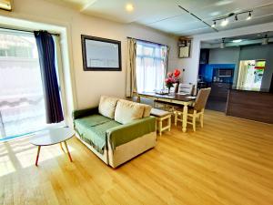 a living room with a couch and a table at Regent Residential House in Whangarei