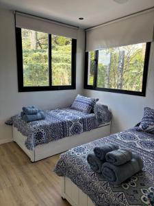 Ένα ή περισσότερα κρεβάτια σε δωμάτιο στο Increíble casa - Desconectá +18 φωτογραφίες