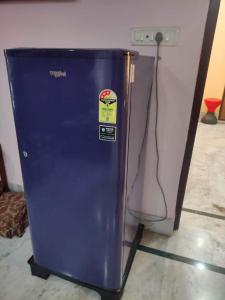 a blue refrigerator with a sticker on the side of it at Luxury penthouse on budget in Kolkata