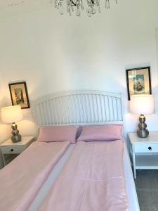 Postel nebo postele na pokoji v ubytování QUEEN HOME Nadia