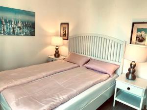 Postel nebo postele na pokoji v ubytování QUEEN HOME Nadia