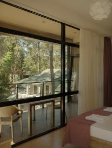 a bedroom with a view of a balcony at Aparthotel Majak Shekvetili in Shekvetili +47 photos