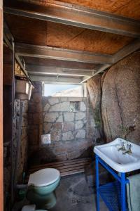 a bathroom with a sink and a toilet at Rustic Mountain Shelter Pure Nature in Las Rabonas