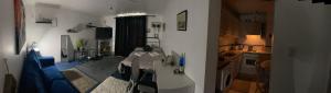 a living room and kitchen with a table in a room at CustomerHouse Dublin 1, Balcony View in Dublin