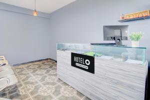 a reception desk with a nittilus sign on it at Super Hotel O Ramavarapadu Near PVR Icon in Vijayawada