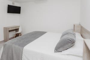 Letto o letti in una camera di Hotel Plataneras Caney