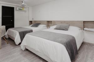 Letto o letti in una camera di Hotel Plataneras Caney