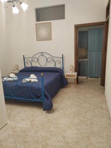 Ένα ή περισσότερα κρεβάτια σε δωμάτιο στο La casa di Tindara