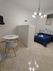 Ένα ή περισσότερα κρεβάτια σε δωμάτιο στο La casa di Tindara