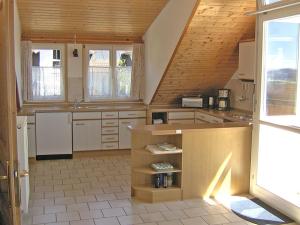 a kitchen with a sink and a counter in a room at Haus Sonntag in Frickingen