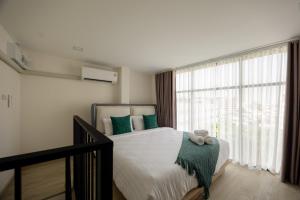 Diff Apartel Banglamphu 객실 침대