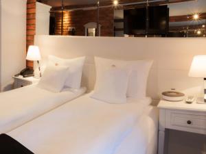 Posteľ alebo postele v izbe v ubytovaní Hotel Betmanowska Main Square Residence Adults Only