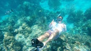 a man giving the thumbs up while swimming in the ocean at Florida Keys Boat Trips Multi Activity in Islamorada