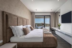 a bedroom with a large white bed and a desk at Villa One Debeljak Zadar in Debeljak +47 photos