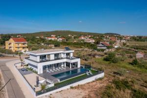 an aerial view of a house with a swimming pool at Villa One Debeljak Zadar in Debeljak