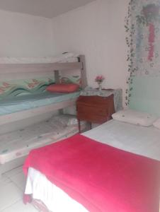 Postel nebo postele na pokoji v ubytování Suites com Wi-fi em Itajai