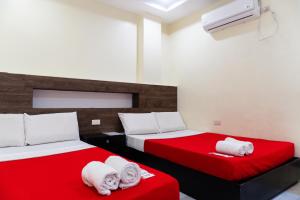 The JRJF Hotel near Tagum Terminal客房内的一张或多张床位