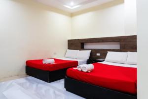 The JRJF Hotel near Tagum Terminal客房内的一张或多张床位