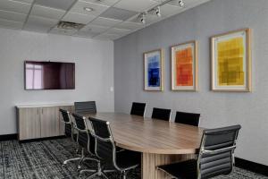 a conference room with a wooden table and chairs at Holiday Inn Express & Suites Oklahoma City Northwest by IHG in Oklahoma City +14 photos