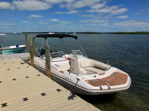 a boat is docked at a dock on the water at Florida Keys Boat Trips Multi Activity in Islamorada