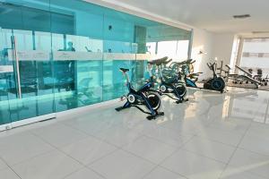 a row of scooters parked in a room at Apartamento en Edificio Palmetto Beach frente a la Playa in Cartagena de Indias