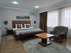 Кровать или кровати в номере Ziyorat Luxury Hotel